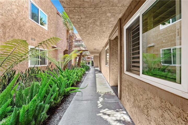 Property Photo:  6600 Warner Avenue 119  CA 92647 
