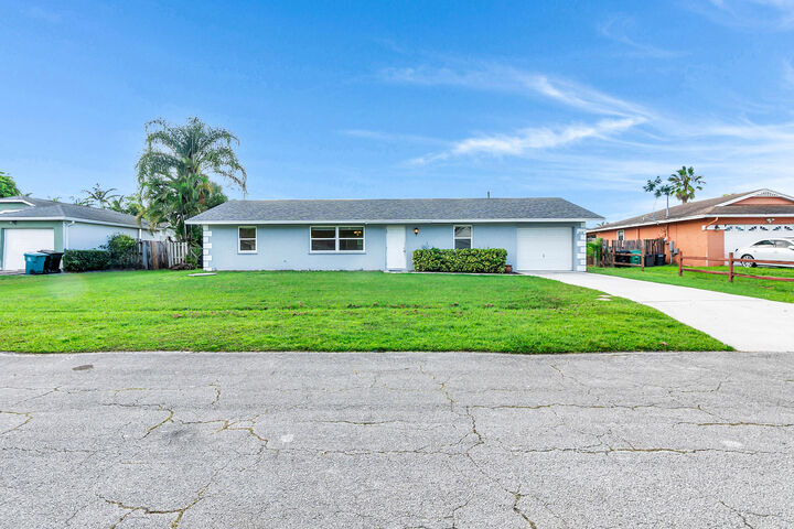 Property Photo: 2458 SW Hinchman Street FL 34984
