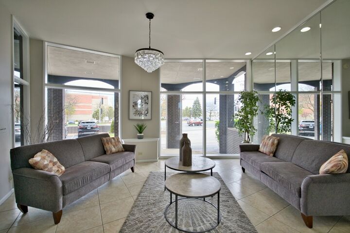Property Photo:  4901 Golf Road 310  IL 60077 