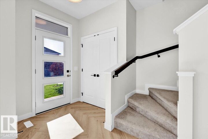 Property Photo: 1328 Keswick Drive SW AB T6W 4V8