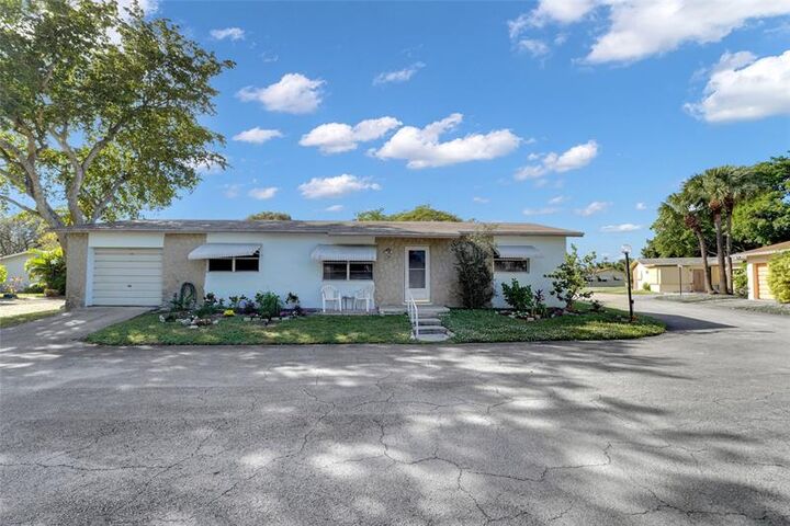 Property Photo: 2617 SW Natura Ave FL 33441
