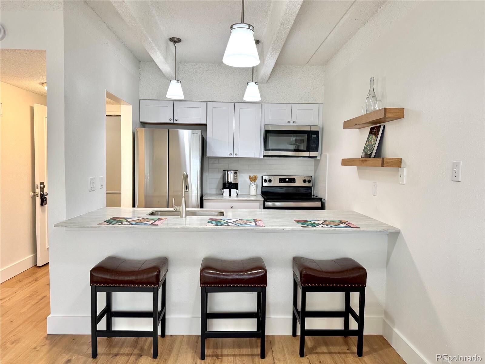 Property Photo: 7877 E Mississippi Avenue 103 CO 80247