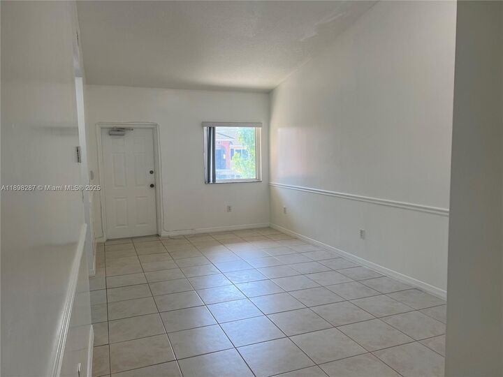 Property Photo:  980 NE 33rd Ter 203  FL 33033 