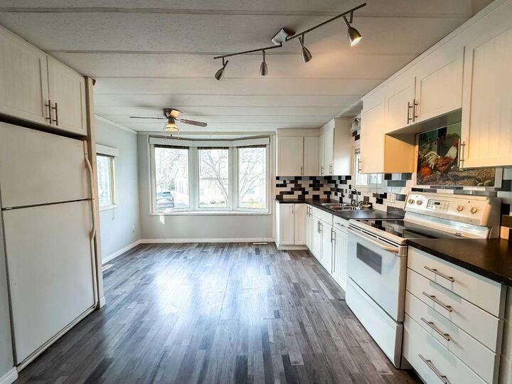 Property Photo: 700 Carmichael Lane 417 AB T7V 1S9