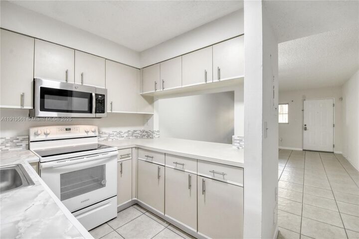 Property Photo: 14900 SW 82nd Ter 14-104 FL 33193