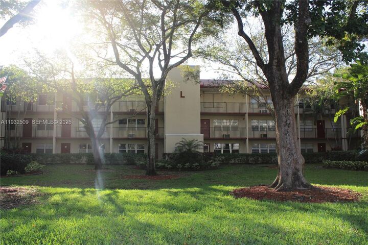 Property Photo:  200 SW 132nd Way 104L  FL 33027 