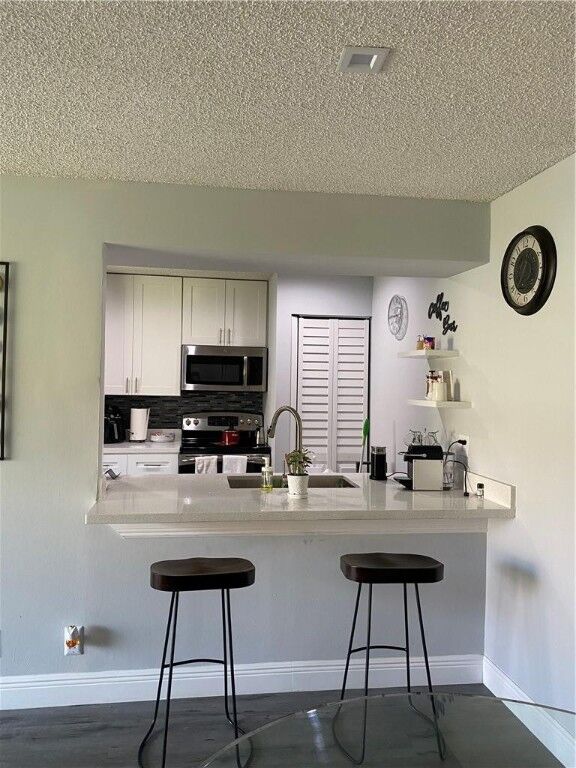 Property Photo:  401 SW 86th Avenue 103  FL 33025 