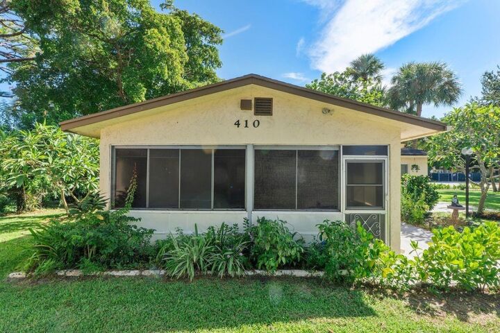 Property Photo:  410 SW Natura Avenue  FL 33441 