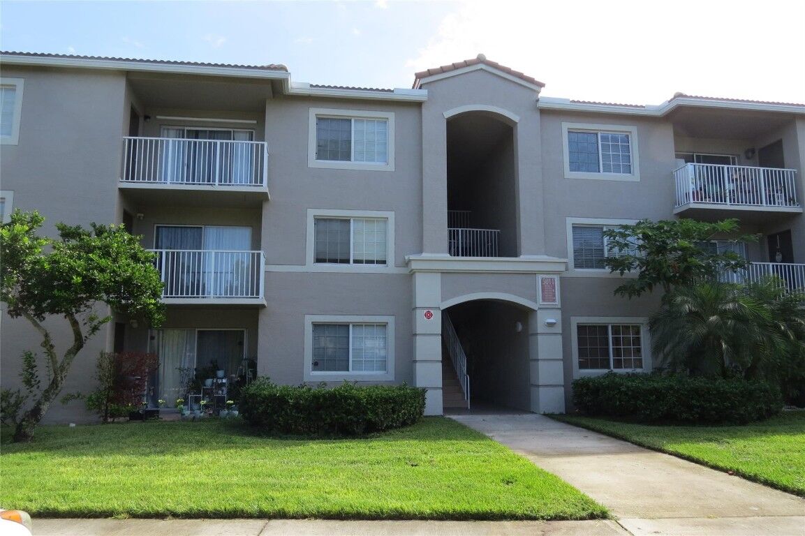 Property Photo:  5011 Wiles Road 201  FL 33073 
