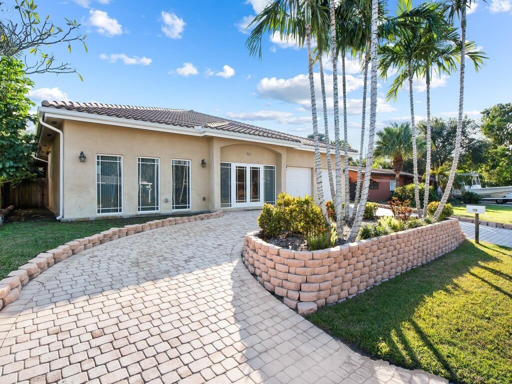 Property Photo:  750 NW 37th Street  FL 33309 