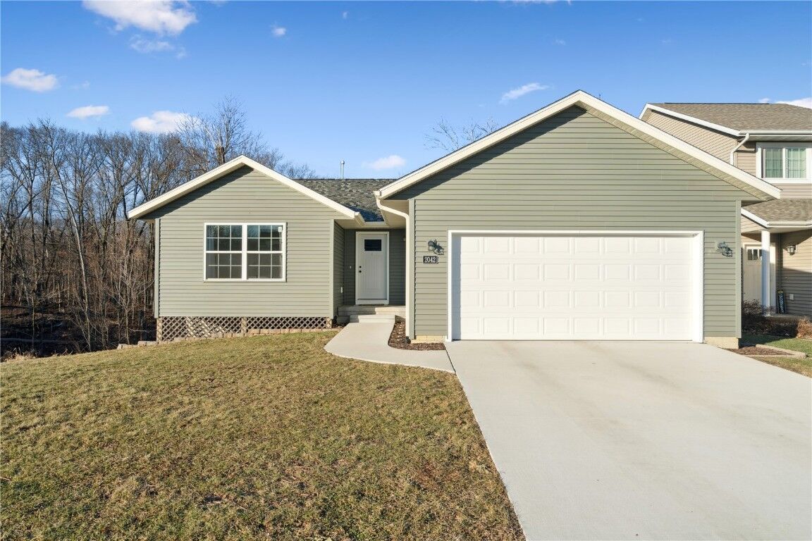 Property Photo:  2042 Sugar Creek Drive NW  IA 52405 