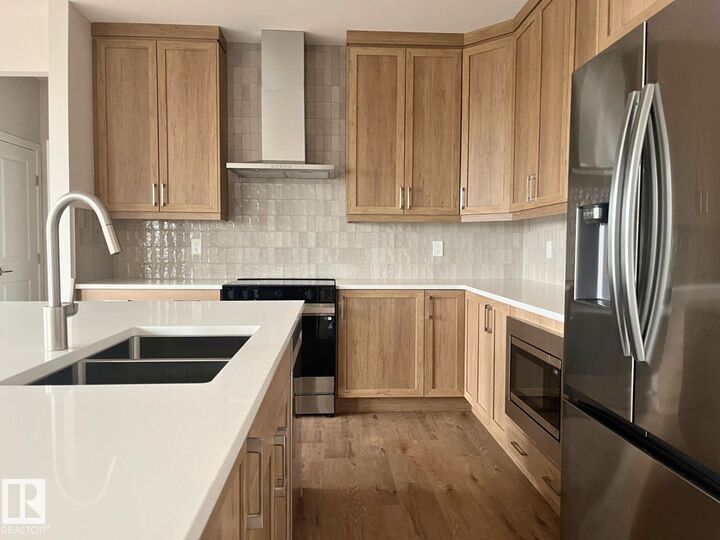 Property Photo:  1027 Wolf Willow Way  AB T8H 3B3 