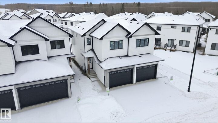 Property Photo:  5122 213A Street NW 61  AB T6M 1M6 