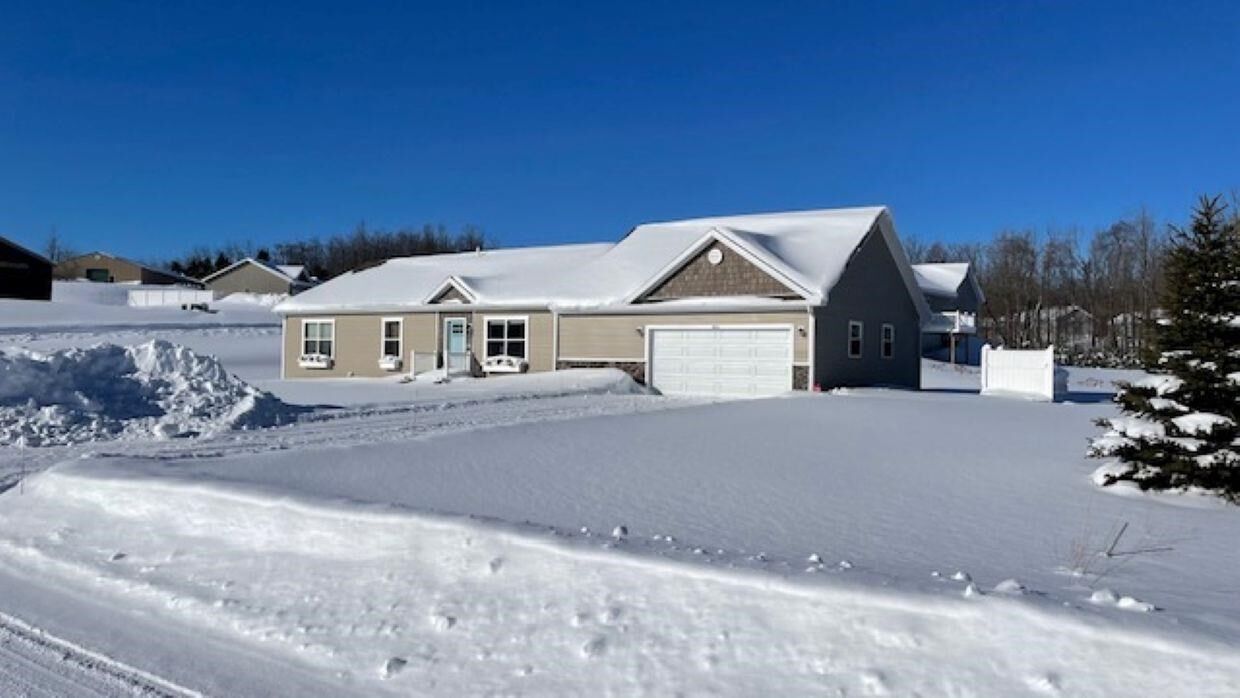 Property Photo:  815 Windsong Place  MI 49770 