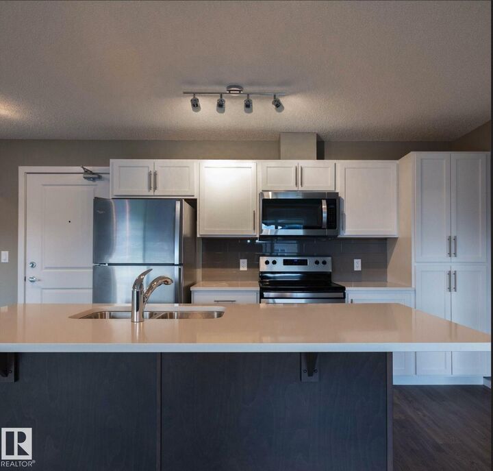 Property Photo: 394 Windermere Boulevard NW 210 AB T6W 0R1