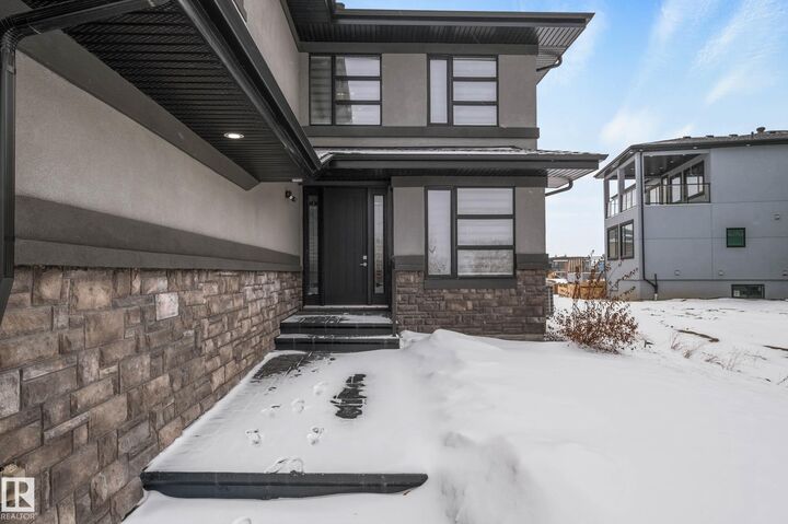 Property Photo: 4086 Whispering River Drive SW AB T6W 2E2