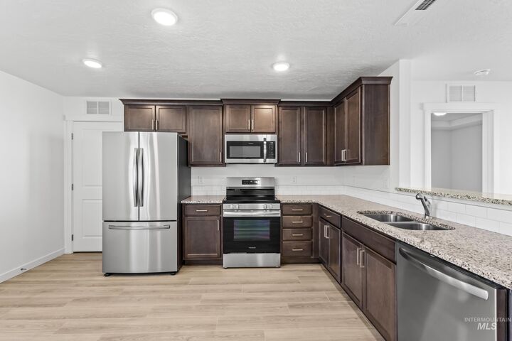 Property Photo:  12320 Shadow River St  ID 83607 