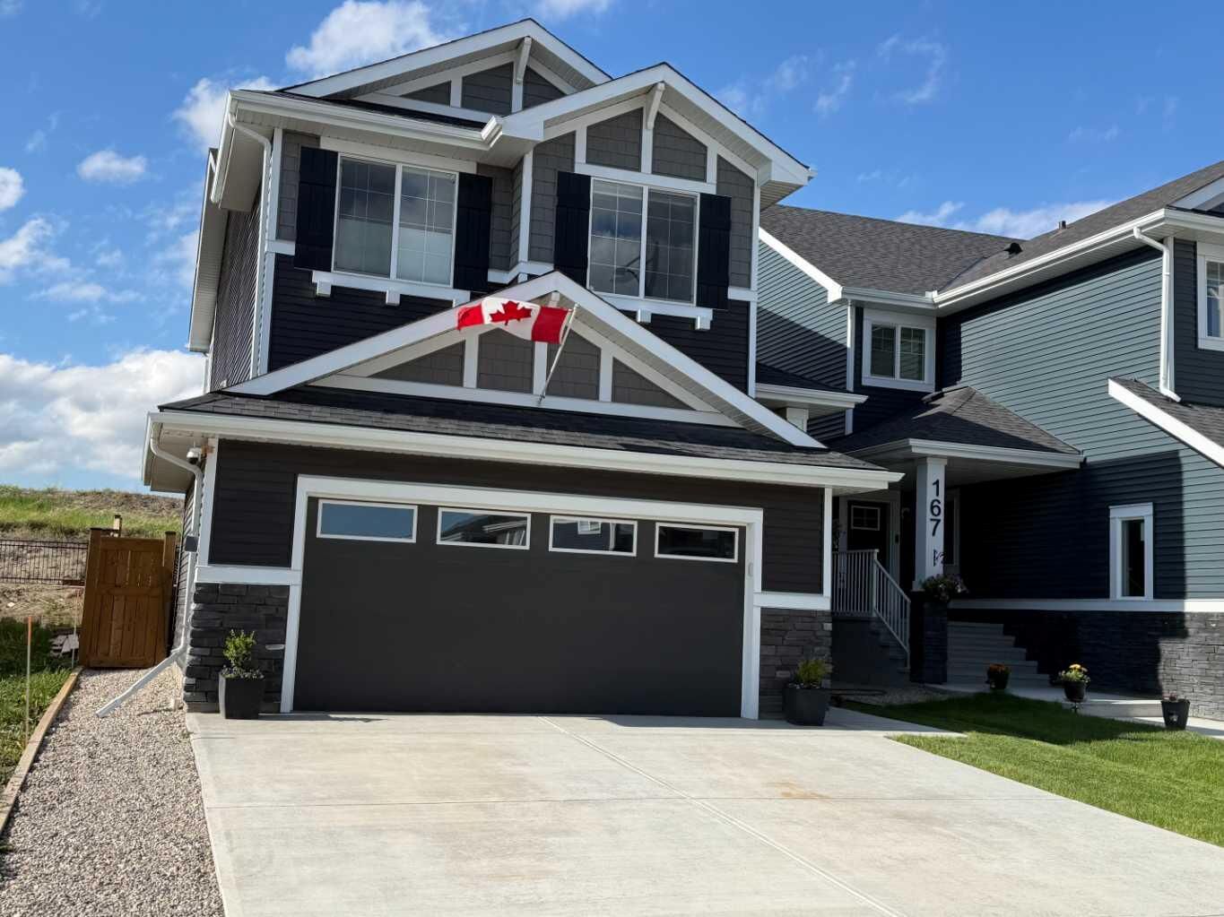 Property Photo: 163 Sundown Crescent AB T4C 2A6