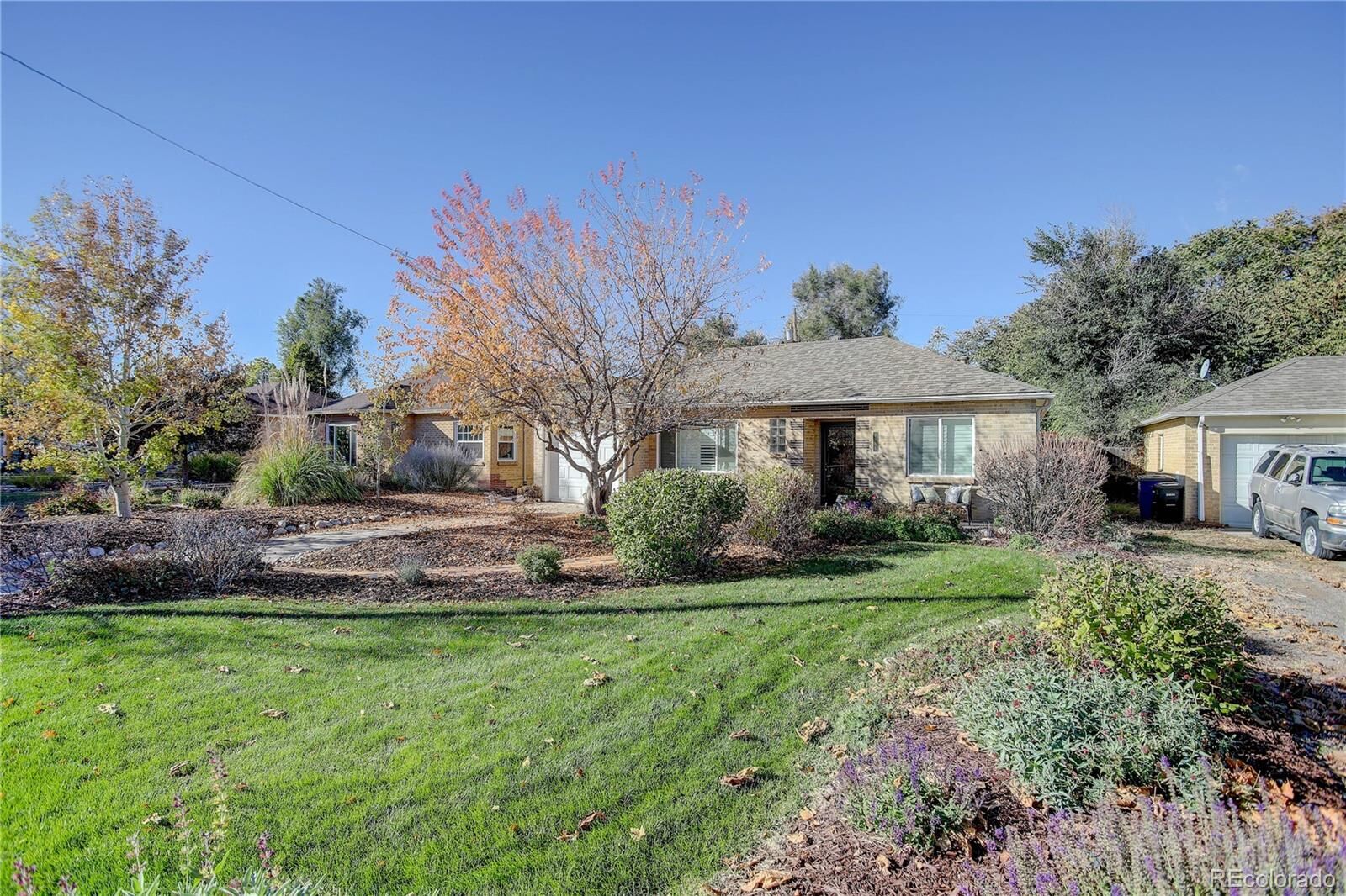 Property Photo:  2555 Poplar Street  CO 80207 