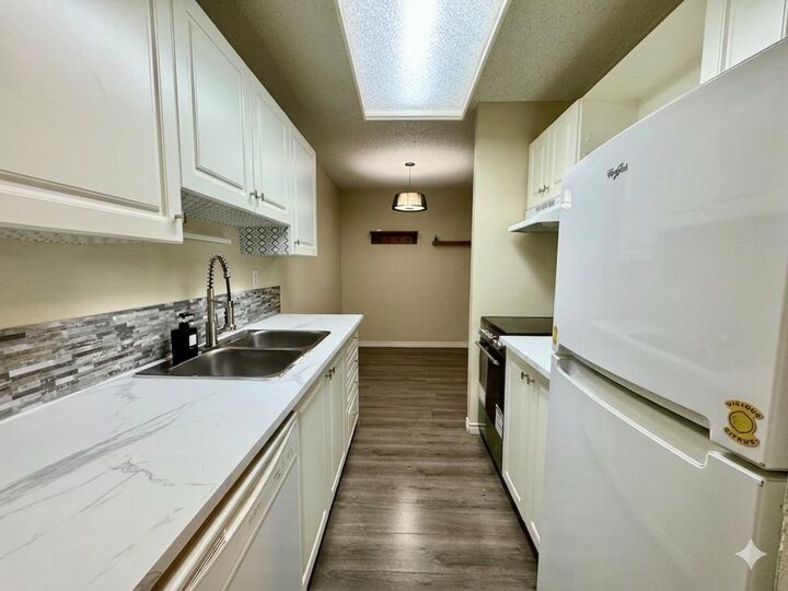 Property Photo:  231 Heritage Drive SE 83E  AB T2H 1N1 