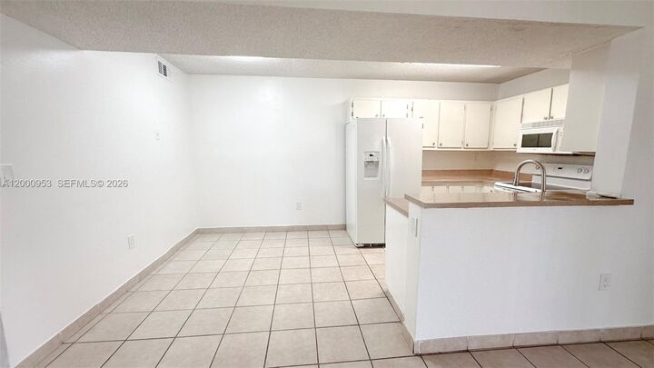 Property Photo:  9491 S Palm Cir S 103  FL 33025 