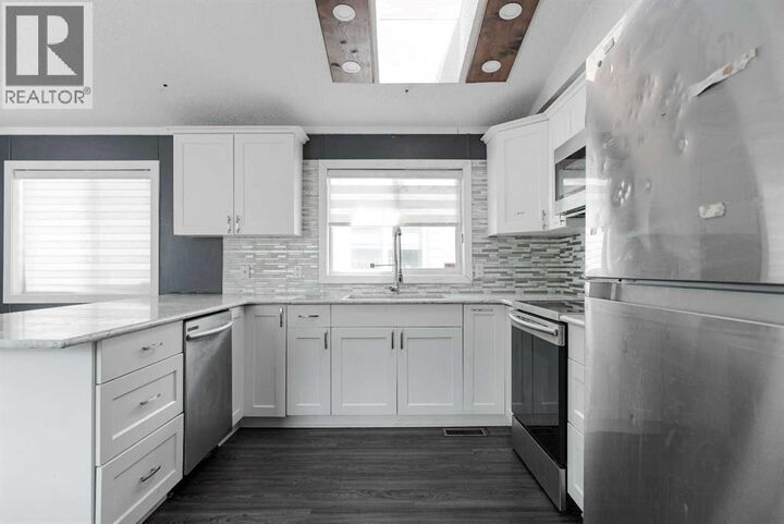 Property Photo:  216 Harpe Way  AB T9K 2K8 