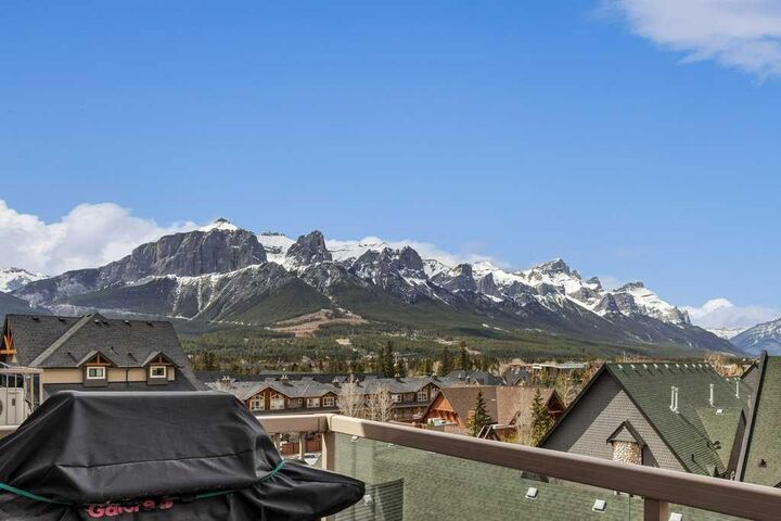 Property Photo: 160 Kananaskis Way 406 AB T1W 3E2