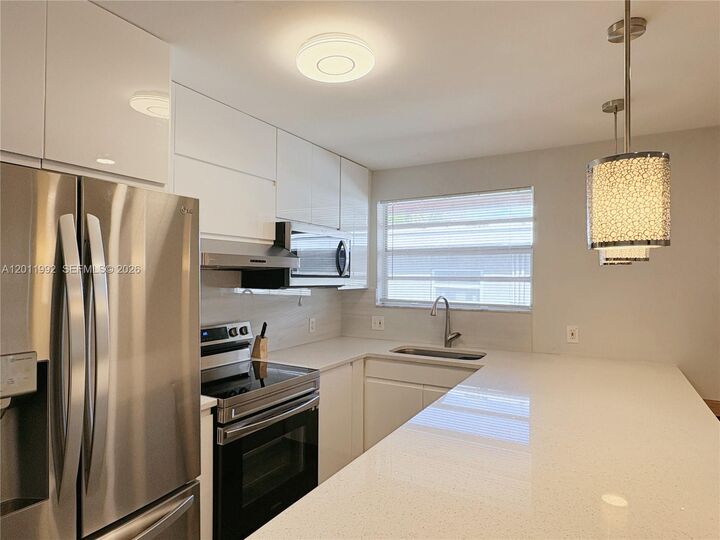 Property Photo:  724 NE 3rd St 1  FL 33009 