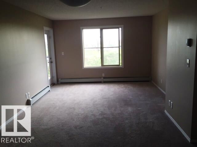 Property Photo:  12035 22 Avenue SW 206  AB T6W 2X9 