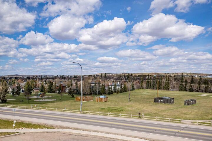 Property Photo:  77 George Fox Trail W 213  AB T4C 0N1 