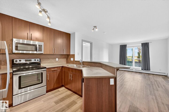 Property Photo:  2208 44 Avenue NW 215  AB T6T 0G6 