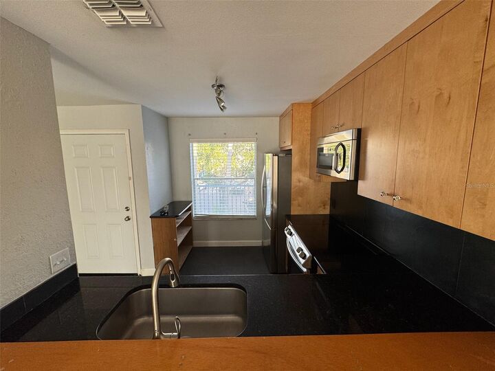 Property Photo:  2568 Woodgate Boulevard 205  FL 32822 