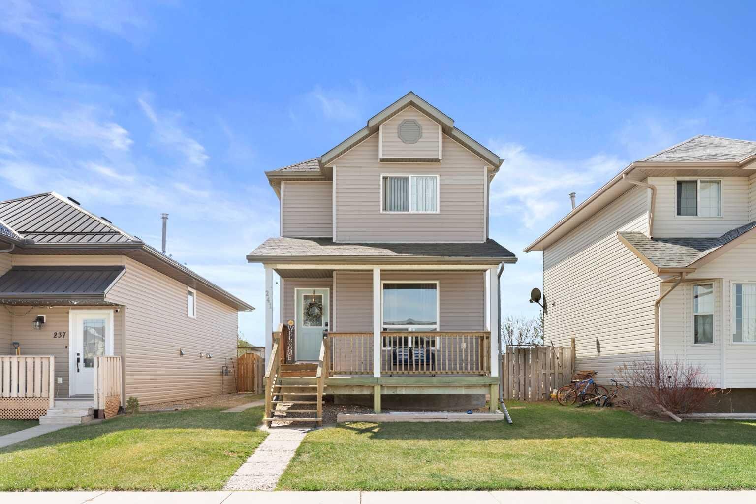 Property Photo:  241 Upland Boulevard W  AB T1R 0R1 