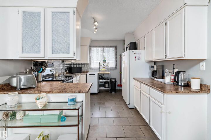 Property Photo: 12916 69 Street NW AB T5C 0H2