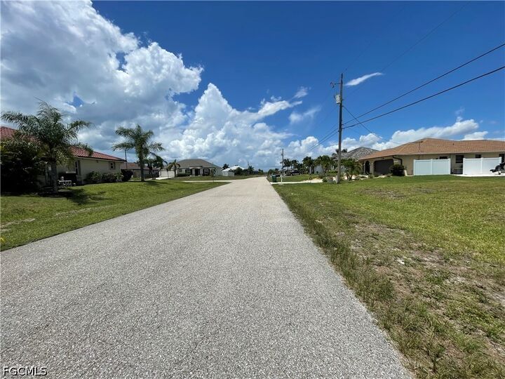 Property Photo:  825 NW 33rd Place  FL 33993 