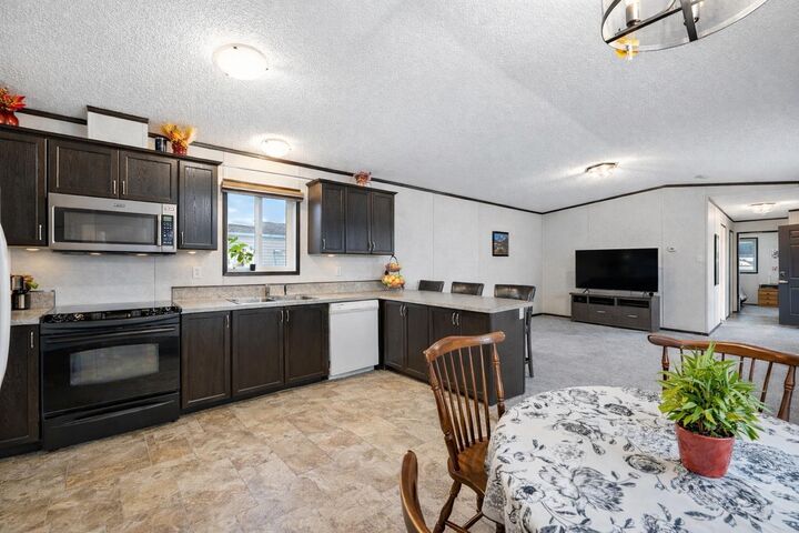 Property Photo: 113 Heritage Drive AB T1S 1M4