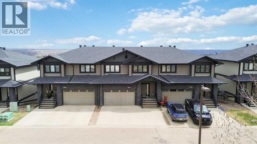Property Photo:  208 Sparrow Hawk Drive  AB T9K 0Y8 