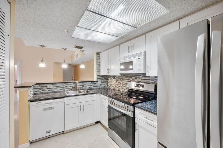 Property Photo: 5011 Wiles Road 303 FL 33073