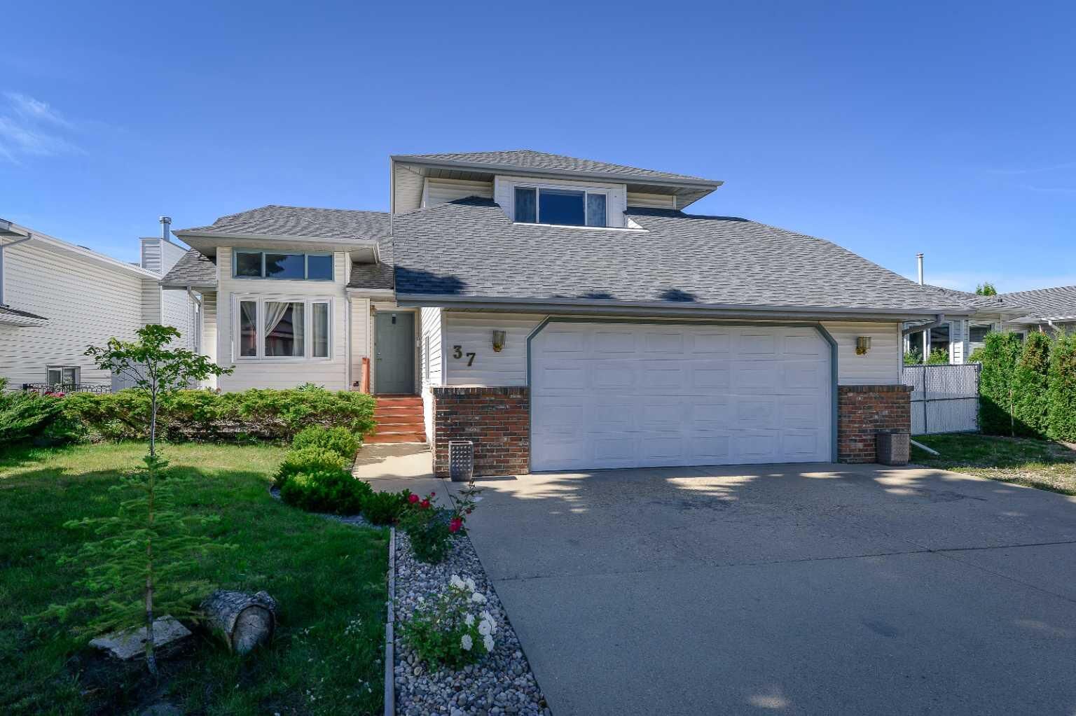 Property Photo: 37 Denovan Crescent AB T4R 2B6