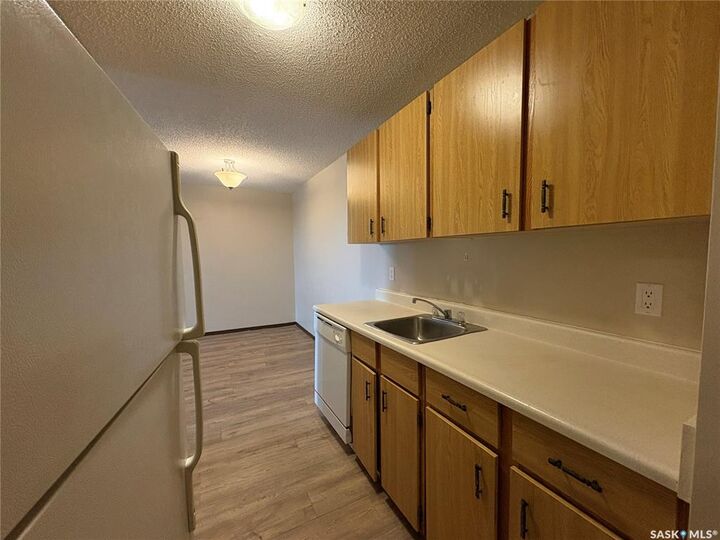 Property Photo: 1140 9th Avenue NE 303 SK S9H 2S9