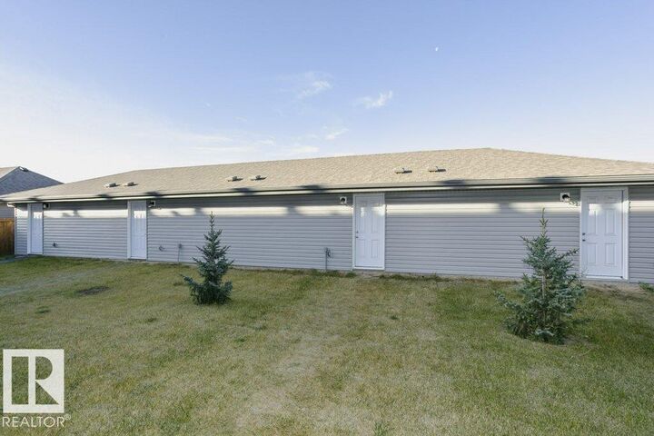 Property Photo:  1537 Sandstone Boulevard  AB T8H 1Z8 