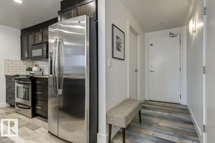Property Photo:  11933 Jasper Avenue NW 205  AB T5K 0P1 
