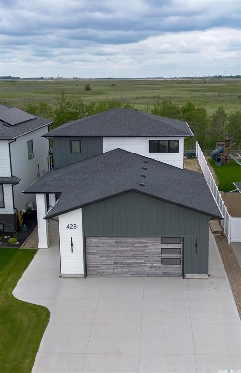 Property Photo: 428 Woolf Bend SK S7W 1E5