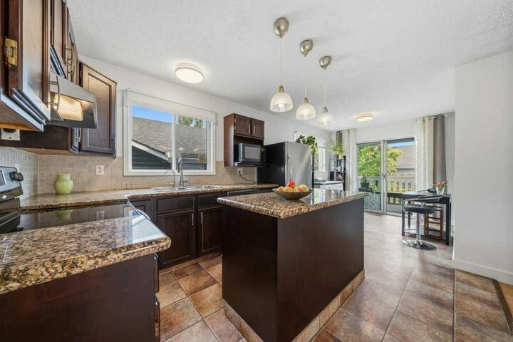 Property Photo: 112 Cedargrove Way SW AB T2W 4V2