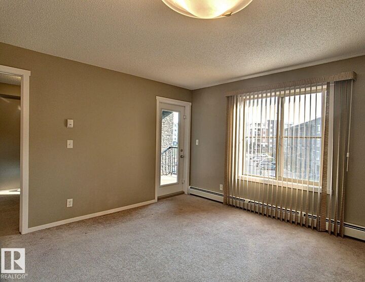 Property Photo: 3315 James Mowatt Trail SW 328 AB T6W 3L9