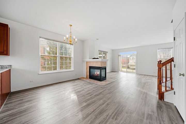 Dining area and fireplace with balcony doors