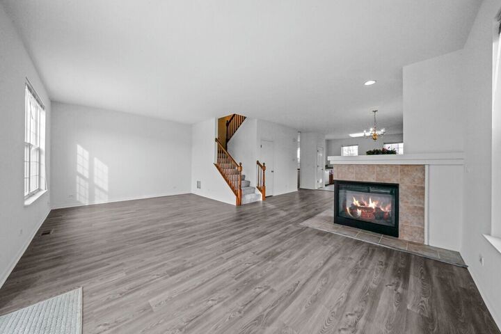 Living room with fireplace and staircase