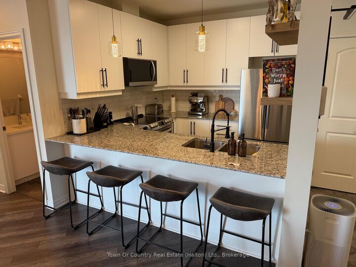 Property Photo:  383 Main Street E 310  ON L9T 8K8 
