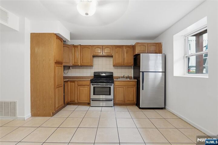 Property Photo:  126-128 N 9th Ground  NJ 07522 