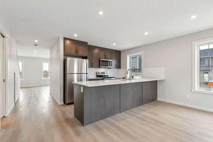 Property Photo:  63 Belmont Passage SW 101  AB T2X 4H7 